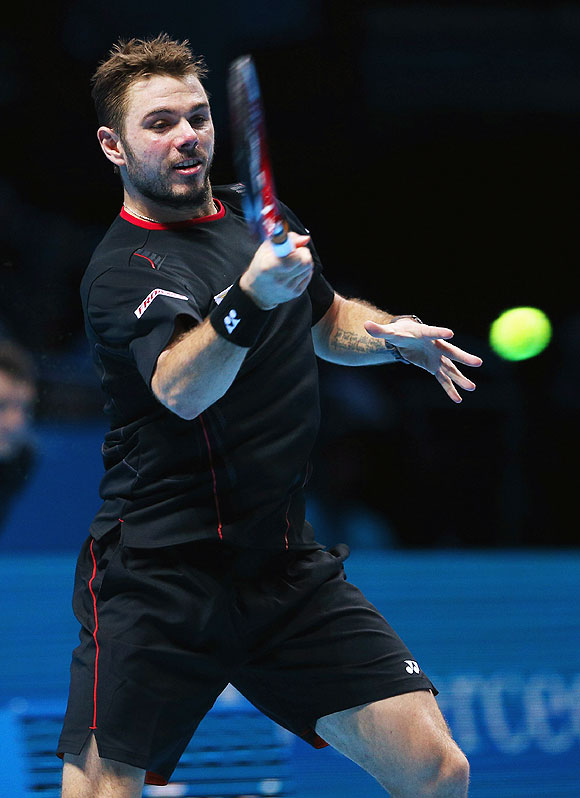 Stanislas Wawrinka  of Switzerland hits a forehand during his men's singles match against Rafael Nadal of Spain during their ATP World Tour Finals match at O2 Arena in London on Wednesday