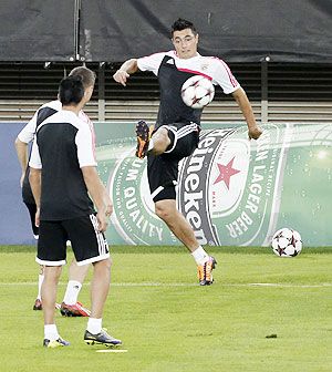 Benfica's Oscar Cardozo kicks the ball during a training session