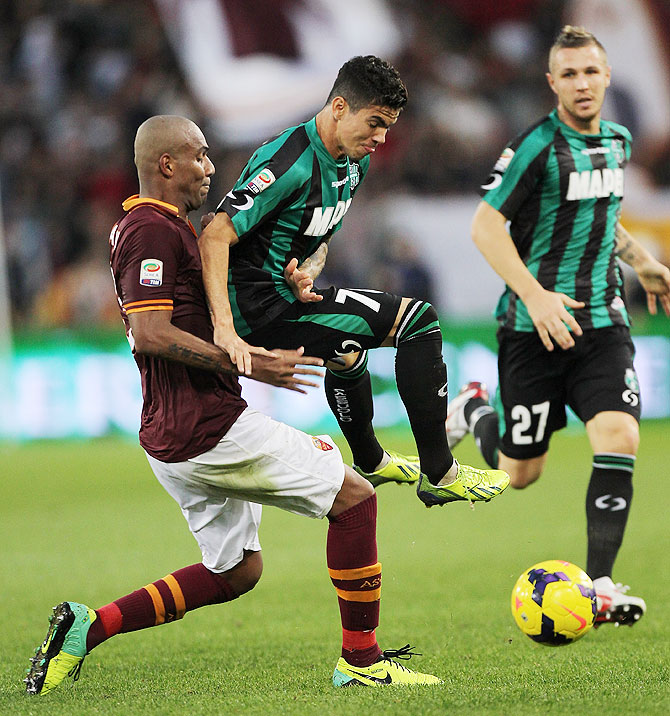 Farias of US Sassuolo Calcio competes for the ball with Maicon (left) of AS Roma during their Serie A match at Stadio Olimpico in Rome on Sunday