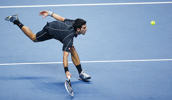 Novak Djokovic of Serbia plays a shot to Rafael Nadal of Spain during their men's final at the ATP World Tour Finals at the O2 Arena in London on Monday