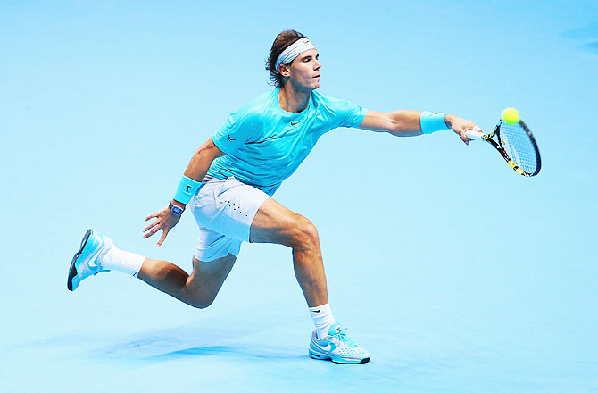 Rafael Nadal of Spain hits a forehand in his men's singles final match against Novak Djokovic of Serbia during the ATP World Tour Finals at O2 Arena in London on Monday