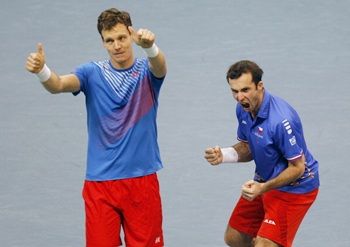 Tomas Berdych (left) and Radek Stepanek of Czech Republic celebrate victory in their men's doubles match