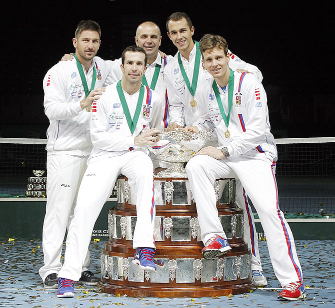 Tomas Berdych, Radek Stepanek team captain Vladimir Safarik, Lukas Rosol and Jan Hayek of Czech Republic hold the winners trophy aloft after a 3-2 victory against Serbia during day three of the Davis Cup World Group Final between Serbia and Czech Republic at Kombank Arena in Belgrade, Serbia, on Sunday