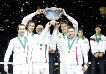 (L-R) Radek Stepanek, Lukas Rosol (team captain), Vladimir Safarik, Tomas Berdych and Jan Hayek of Czech Republic hold the winners trophy aloft after a 3-2 victory against Serbia