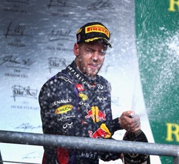 Sebastian Vettel of Germany and Infiniti Red Bull Racing celebrates on the podium after winning the United States Formula One Grand Prix at Circuit of The Americas