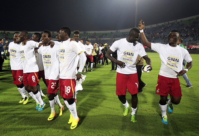 Ghana's soccer team players break into a jig as they celebrate after their 2014 World Cup qualifying second leg playoff match against Egypt at Air Defence 30 June stadium in Cairo, on TUesday