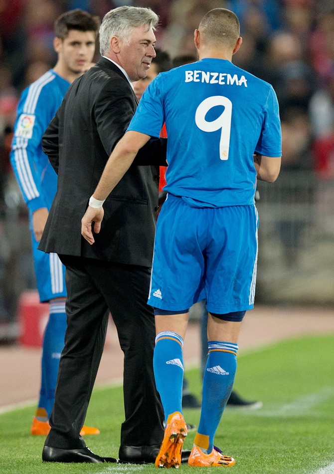 Karim Benzema of Real Madrid CF celebrates scoring their second goal with his head coach Carlo Ancelotti