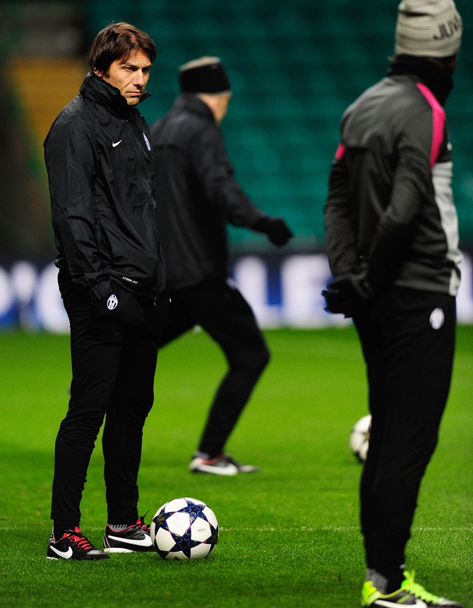 Juventus manager Antonio Conte (left) and Andrea Pirlo look on during the Juventus training session