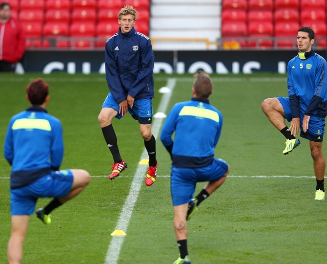 Stefan Kiessling (centre) of Bayer Leverkusen warms up during a team training session