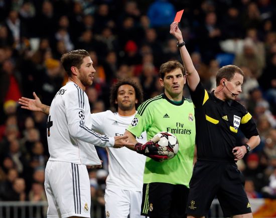 Referee William Collum shows a red card to Real Madrid's Sergio Ramos 