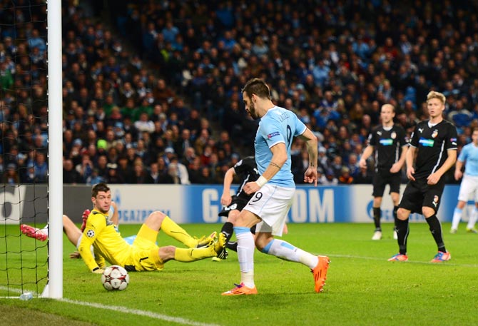 Alvaro Negredo of Manchester City scores his team's third goal