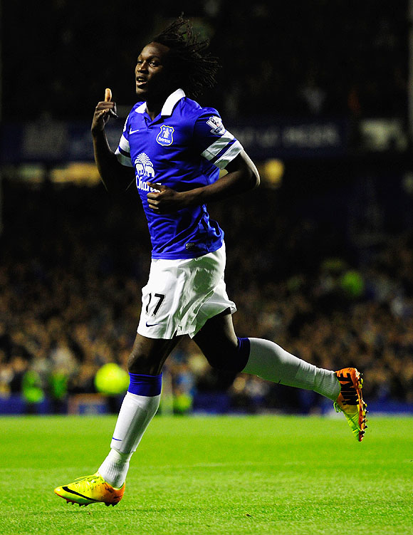 Everton striker Romelu Lukaku (centre) celebrates after scoring the first goal against Newcastle United during their Premier League match at Goodison Park on Monday