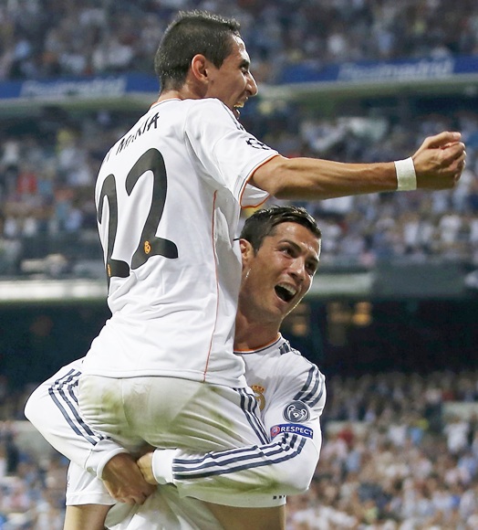 Real Madrid's Angel Di Maria (22) celebrates his goal with with   teammate Cristiano Ronaldo during their Champions League   match against FC Copenhagen at Bernabeu stadium in Madrid on Wednesday night