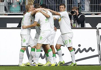 Borussia Moenchengladbach's Max Kruse (right) and teammates celebrate a goal against Borussia Dortmund during their Bundesliga match in Moenchengladbach on Saturday
