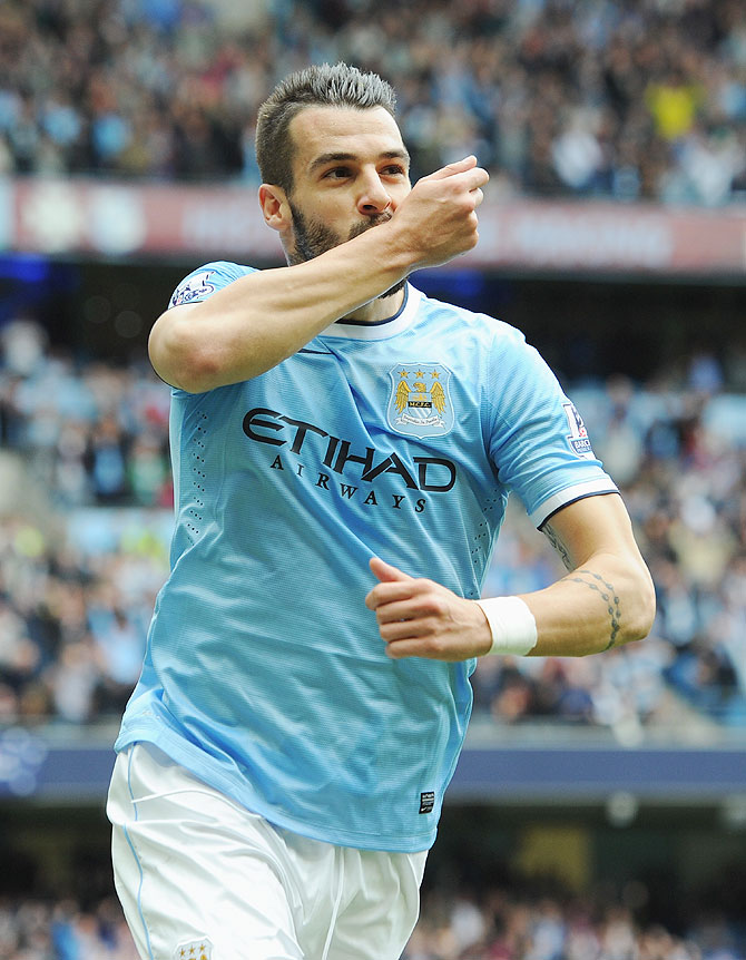 Alvaro Negredo of Manchester City celebrates after scoring to level the scores against Everton during their English Premier League match at Etihad Stadium on in Manchester on Saturday