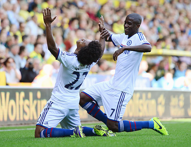 Chelsea's Willian celebrates with teammate Ramires after scoring against Norwich City during their English Premier League match at Carrow Road in Norwich on Sunday