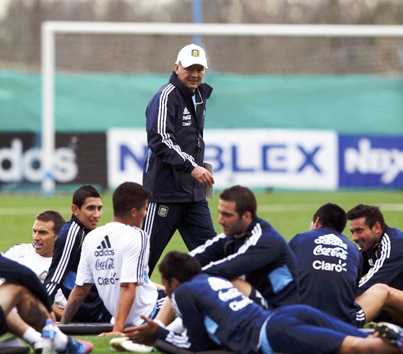 Argentina's head coach Alejandro Sabella (centre) walks past his players during a training session