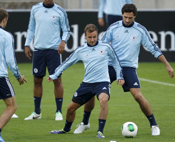 Germany's national soccer player Mats Hummels (right) tackles Mario Goetze during a training session