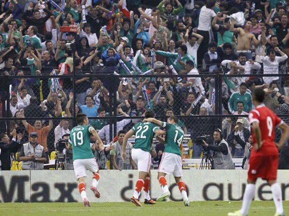 Mexico's Raul Jimenez (22) celebrates with team mates