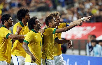 Brazil's Neymar (2nd from right) celebrates with teammates after scoring a goal against South Korea