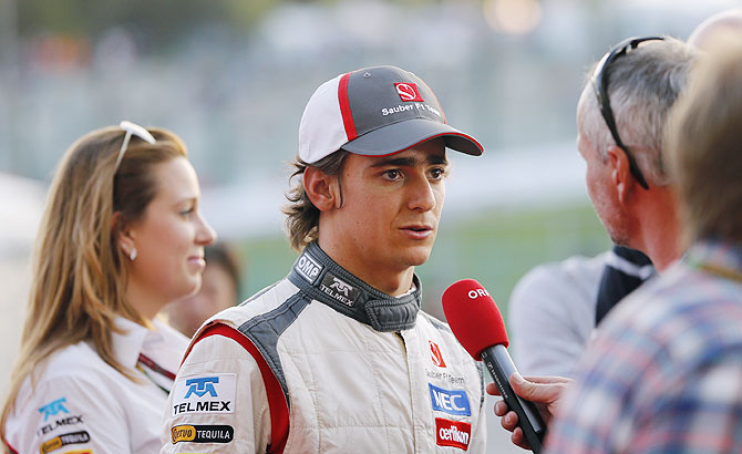 Sauber Formula One driver Esteban Gutierrez of Mexico talks to the media after the Japanese F1 Grand Prix at the Suzuka circuit on Sunday