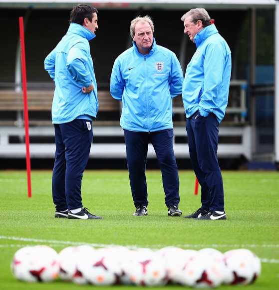 England manager Roy Hodgson talks to coaches Gary Neville and Ray Lewington during an England Training session