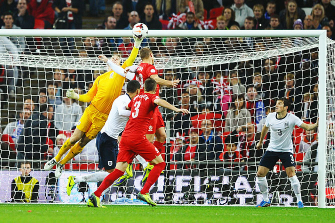 England goalkeeper Joe Hart makes a save during the FIFA 2014 World Cup Qualifying Group H match against Poland at Wembley Stadium in London on Wednesday