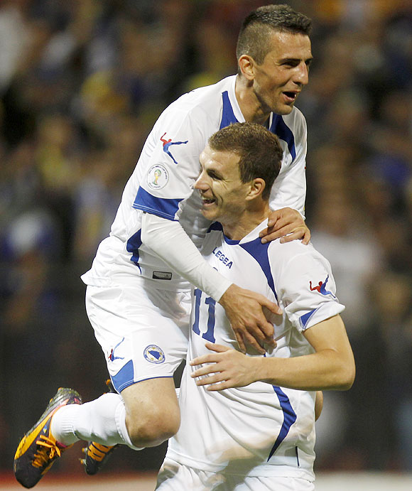 Bosnia's Vedad Ibisevic (left) and Edin Dzeko celebrate a goal 