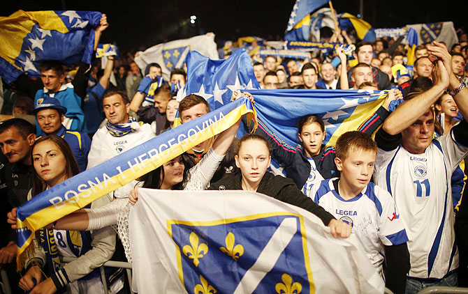 Bosnia soccer national team fans celebrate their 2014 World Cup qualifying match victory over Lithuania, in Sarajevo on Tuesday