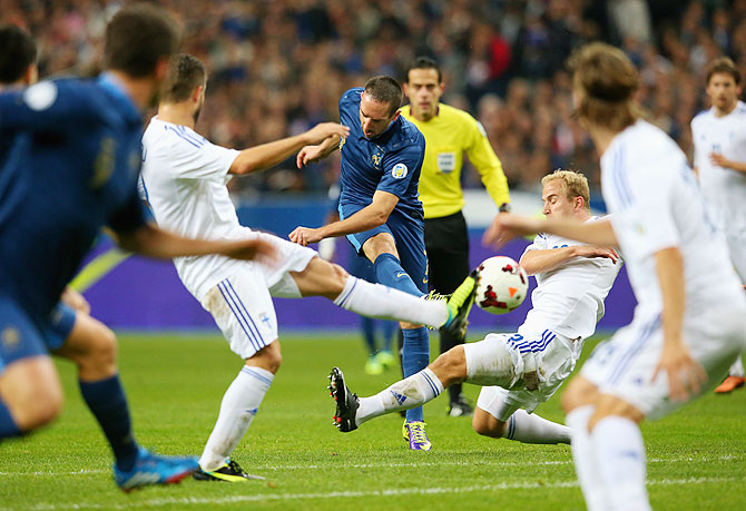 Franck Ribery of France shoots and scores the opening goal during the FIFA 2014 World Cup Qualifying Group I match against Finland at the Stade de France in Paris on Tuesday