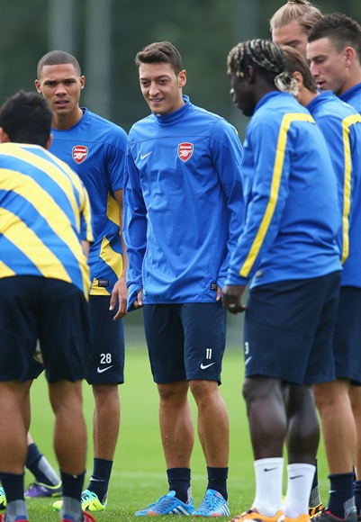 Mesut Oezil of Arsenal warms up during a training session