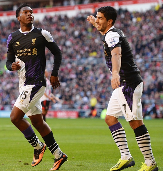 Daniel Sturridge (left) of Liverpool celebrates with Luis Suarez