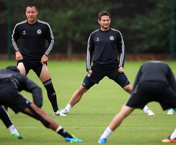 John Terry and Frank Lampard of Chelsea look on during a training session