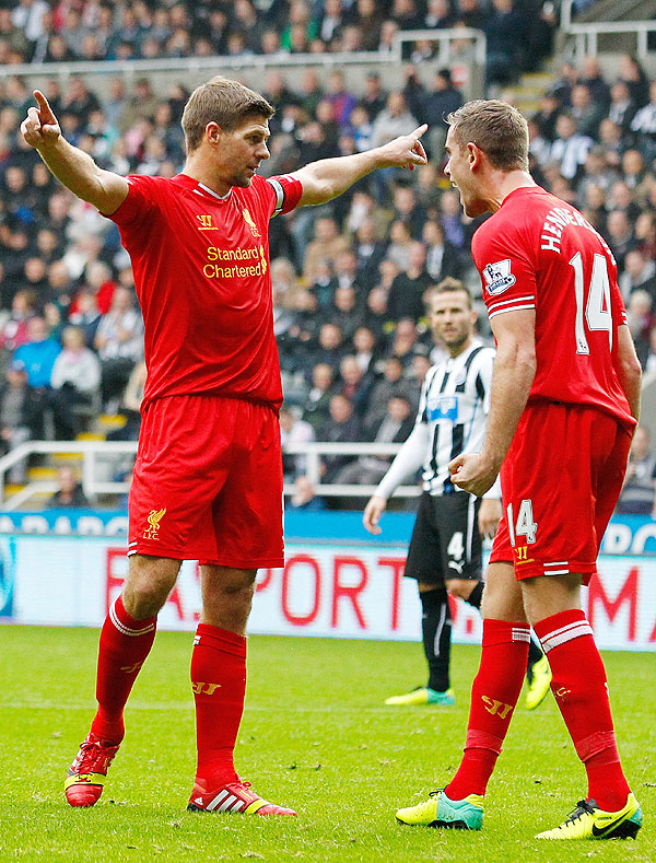 Steven Gerrard (left) of Liverpool celebrates scoring his 100th Premier League goal with teammate Jordan Henderson during their English Premier League match against Newcastle United  at St James' Park in Newcastle on Saturday