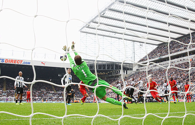 Tim Krul of Newcastle United makes a save to deny Luis Suarez of Liverpool in stoppage time during their English Premier League match at St James' Park in Newcastle on Saturday