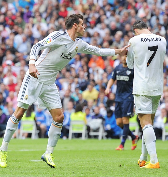 Gareth Bale (left) of Real Madrid CF encourages team-mate Cristiano Ronaldo 