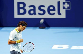 Switzerland's Roger Federer reacts during his match against Adrian Mannarino of France at the Swiss Indoors ATP tennis tournament in Basel