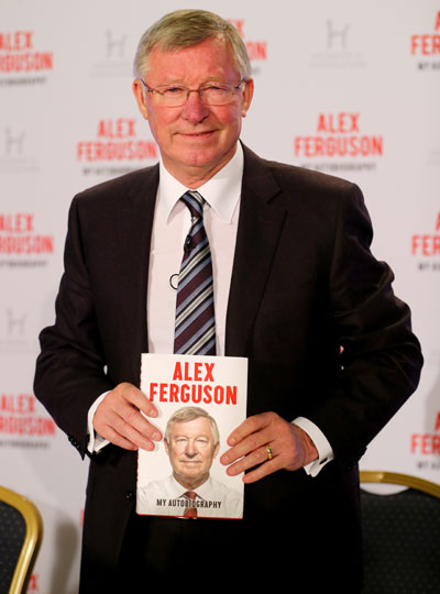 Sir Alex Ferguson poses during a press conference ahead of the publication of his autobiography at the Institute of Directors