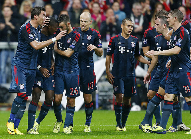 Bayern Munich's David Alaba (2nd from left) celebrates with his teammates after scoring a goal against Viktoria Plzen on Wednesday