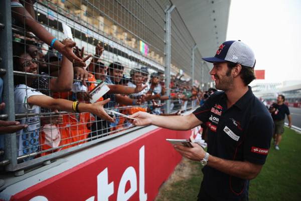 Jean-Eric Vergne of France and Scuderia Toro Rosso signs autographs for the handful of fans at the at Buddh International Circuit