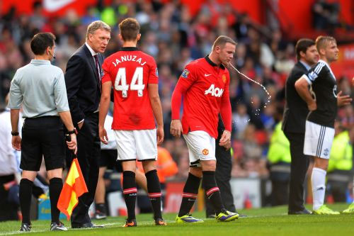 Manchester United's Wayne Rooney with coach David Moyes