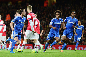 Juan Mata celebrates his goal against Arsenal with teammates during their FA Cup match on Tuesday