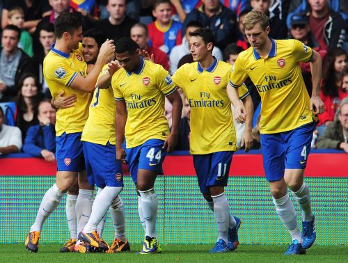Arsenal players celebrate after scoring a goal