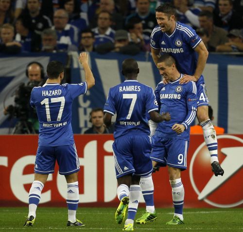 Chelsea players celebrate after scoring a goal 