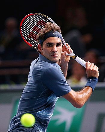 Roger Federer of Switzerland in action against Kevin Anderson of South Africa during day three of the BNP Paribas Masters at Palais Omnisports de Bercy on Wednesday