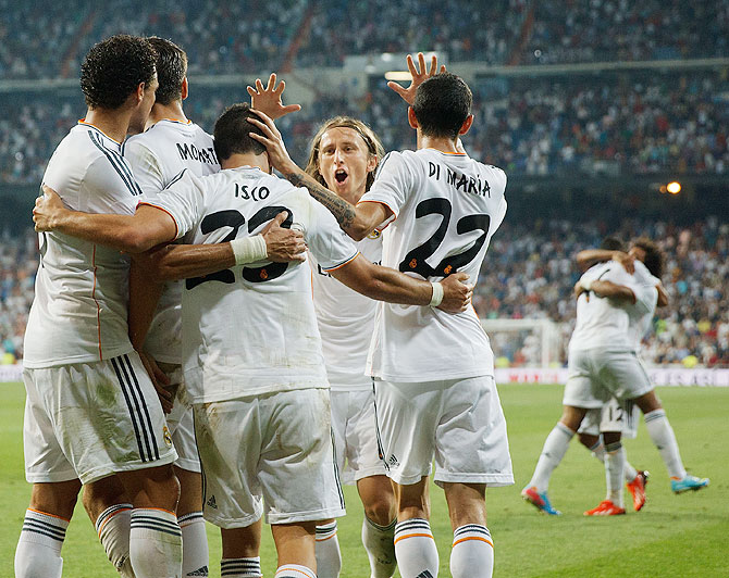 Luka Modric celebrates with teammates after Isco's second goal on Saturday