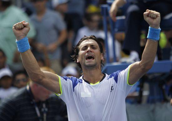 David Ferrer of Spain celebrates after defeating Mikhail Kukushkin of Kazakhstan