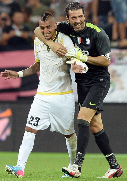 Arturo Vidal and Gianluigi Buffon of Juventus FC celebrate
