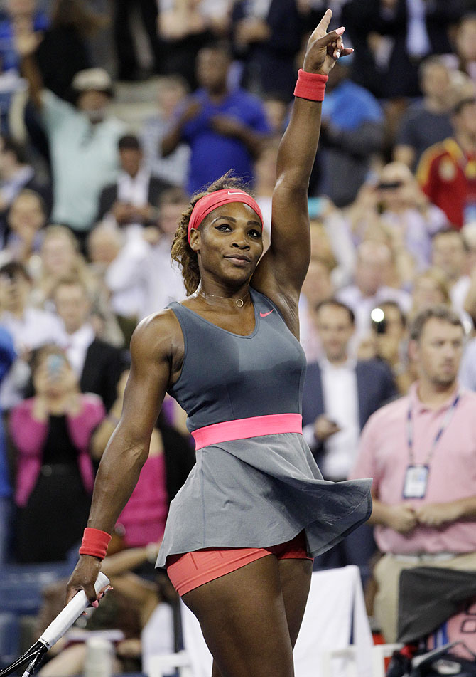 Serena Williams celebrates defeating Carla Suarez Navarro of Spain