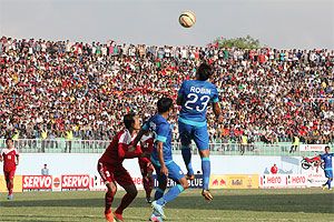 India's Robin Singh and Syed Rahim Nabi challenge a Nepal defender as they threaten the rival goal during their SAFF Cup match at Kathmandu on Thursday